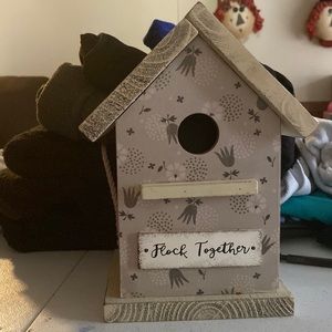 A cute decorative bird house.